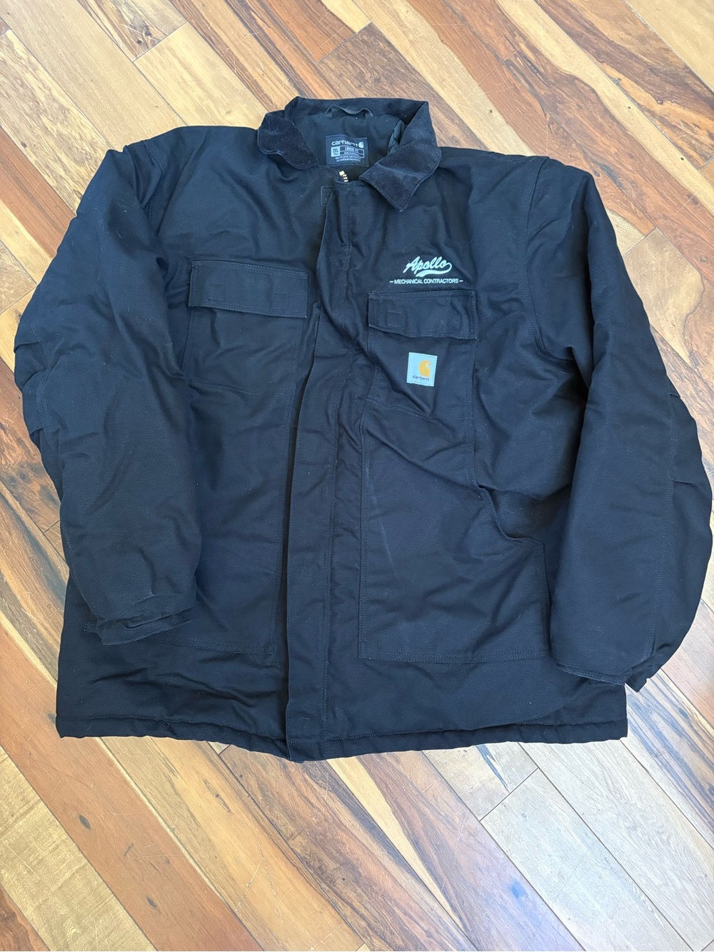 Carhartt Black Heavy-Duty Canvas Jacket with company embroidery